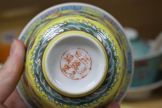 Five Chinese porcelain rice bowls, covers and stands, together with two spoons, second half 20th century, bowls 10.5cm diameter
